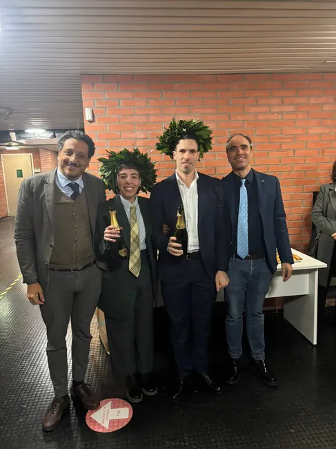 Researchers marking a graduation milestone · 2026