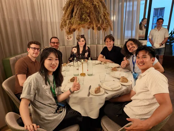 Researchers and collaborators sharing a meal