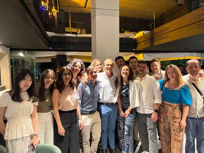 Colleagues and collaborators gathering outside a research event