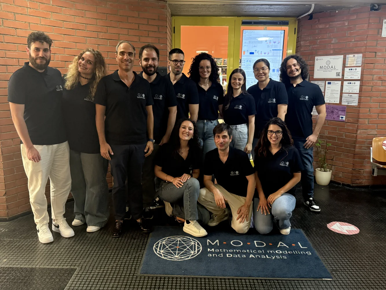 Research group at the lab entrance